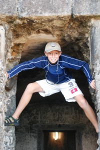 Bryson climbing in the doorway of the fort