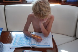 Porter, without a shirt as usual, works on his math.