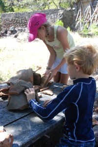 building little houses out of the pottery remains