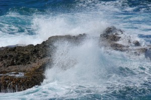waves crashing into the rocks in Calibishie