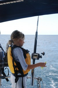 Reese helps to pull in the fishing gear.