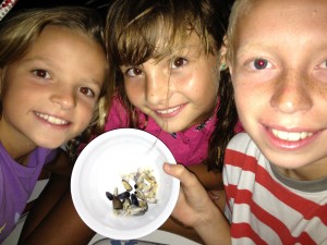 Reese, Kate, and Bryson enjoy their clam appetizers.