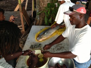Titus and Martin marinading fresh lionfish.