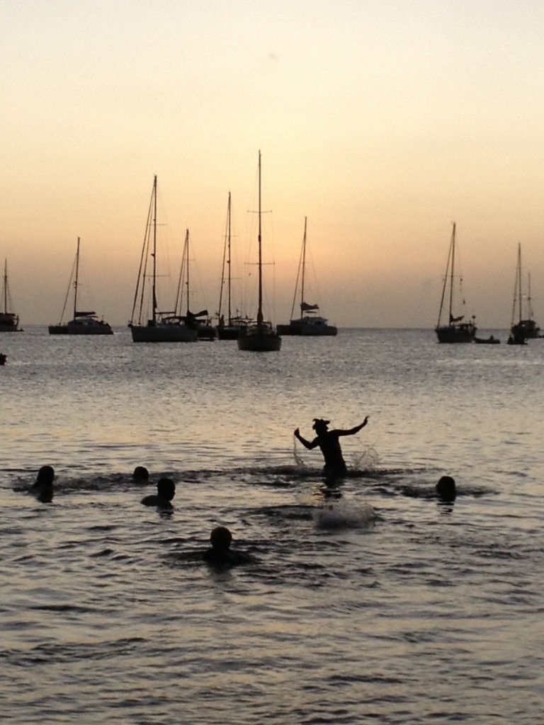 This might be my favorite picture so far.  All our kids and the local kids playing in the beach till way past sunset, while the adults enjoy sundowners on the beach.