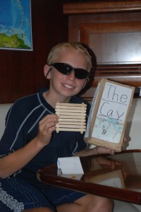 Bryson presents his book report on The Cay, complete with props.