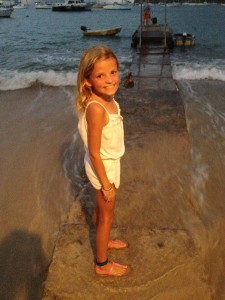 Reese walks the underwater dock to our dinghy after dinner.