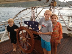 helping to fold the flag on the Harvey Gamage