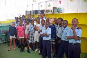 The students welcome us to their school and show us their library.