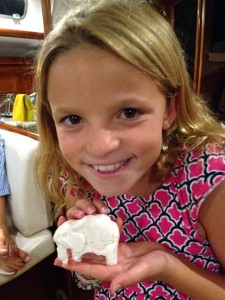 Reese carves an elephant out of soap.