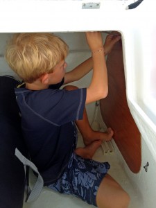 Porter helps with boat projects.