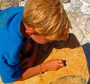 Porter and I play Tic Tac Toe on the rocks while the others go for a long walk.