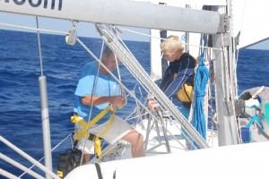 Bryson assists Chris climb the mast while under way.
