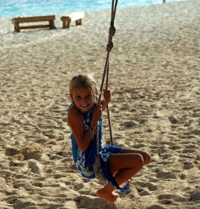Reese swinging on a rope