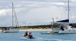 racing dinghies back to the boats