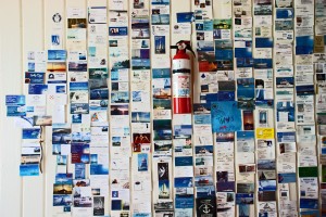 A wall of boat cards from previous visitors to Blackrock Settlement.