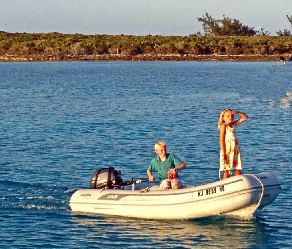 Reese and Bryson operate the dinghy to bring things back and forth.